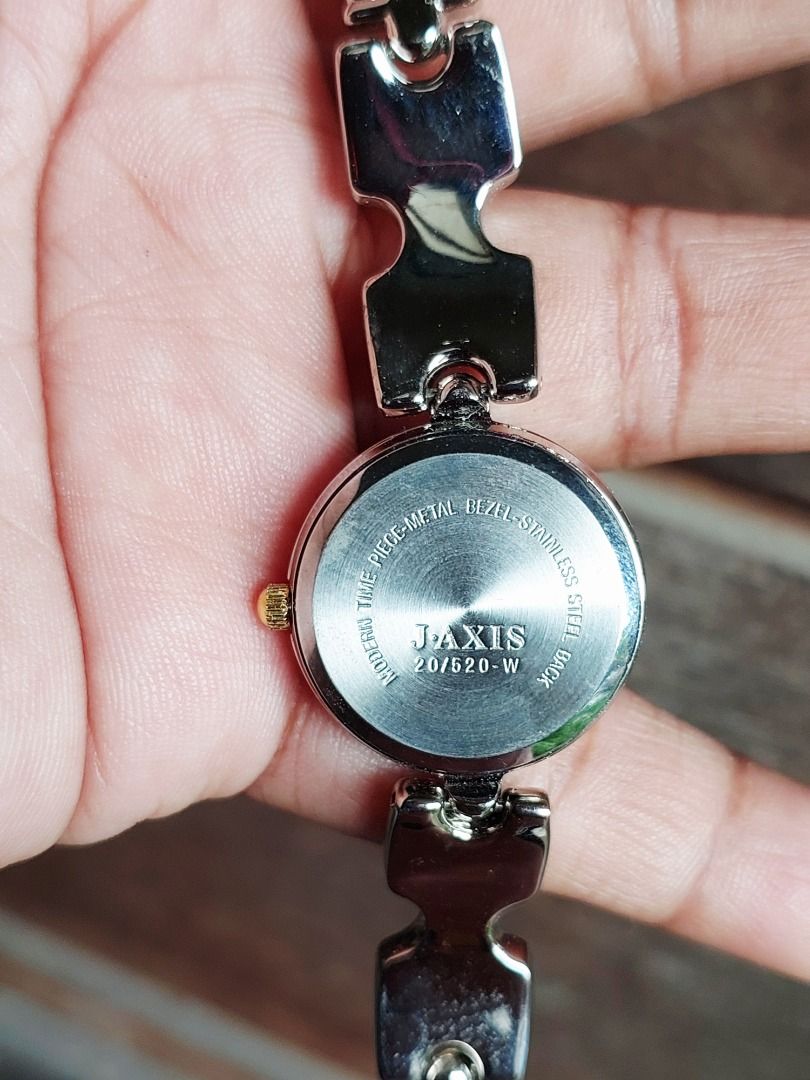 Larue Quartz Two-Tone Watch JAXIS 20/520-W (Category: Women's Watches) located in Batangas. Submitted by vintageanddainty (Listing ID 1470586002, Image 3). Description: - Brand/Model: Larue Quartz Watch (JAXIS 20/520-W) - Design: Two-tone silver and gold metal bezel with stainless steel back - Dial: Classic cream round dial with elegant gold hands and markers - Bracelet: Unique patterned link bracelet combining silver and gold tones for a versati