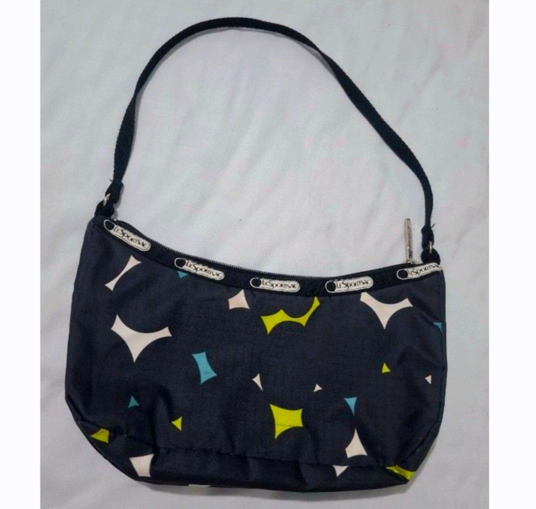 LeSportsac shoulder bag (Category: Shoulder Bags) located in Taguig. Submitted by welcome2myprelovedshop (Listing ID 1470639135, Image 1). Description: soooo cute in person. used this when I go to the beach or festival because of its nylon material and sporty design Light weight and very Spacious. my favourite shoulder bag this prints are limited..