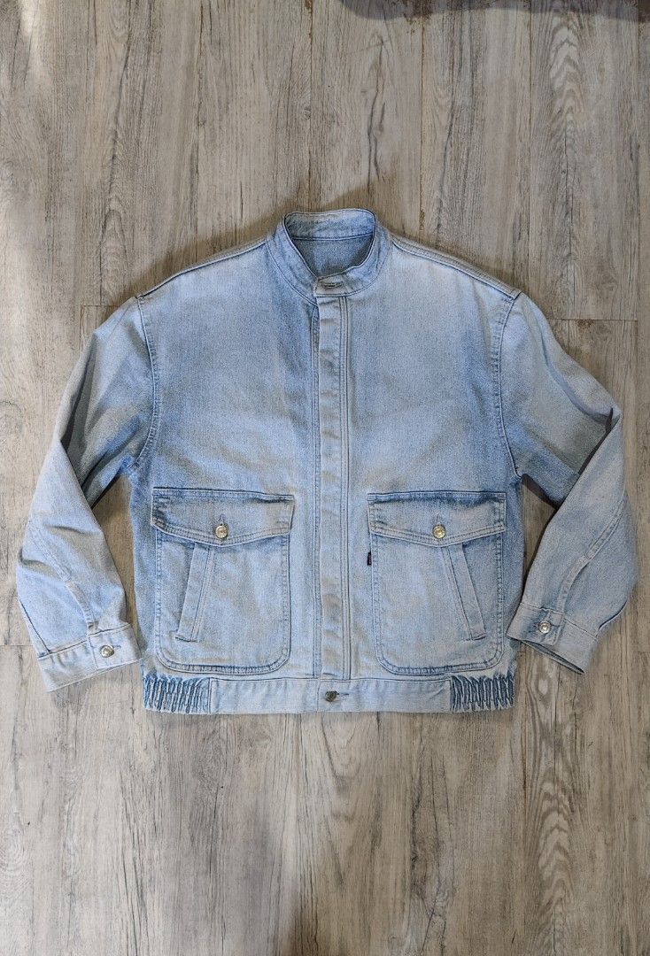 Levi Strauss & Co. Vintage Light Wash Denim Jacket (Category: Coats, Jackets and Outerwear) located in Quezon City. Submitted by truedeer_cda94c (Listing ID 1470607485, Image 1). Description: - Brand: Levi Strauss - Style: Light wash denim jacket with stand collar and retro faded finish - Details: Front utility pockets and metal button closures on front and cuffs - Fit/Back: Comfortable ribbed elastic hem at the back.