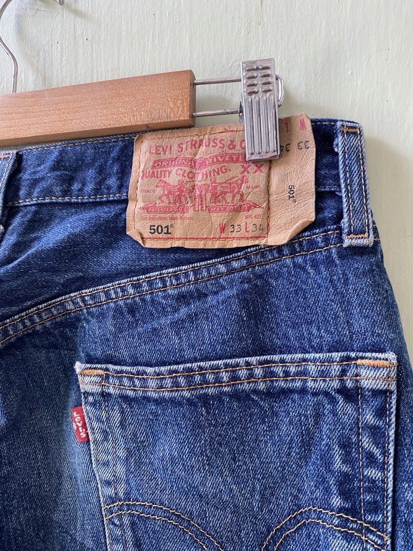 Levi's 501 Extended Patch (Category: Jeans) located in Pandi. Submitted by nasya_thrift_collection2023 (Listing ID 1470575503, Image 3). Description: - Brand: Levi's 501 - Wash: Dark blue - Material: 100% cotton denim - Closure: Button fly - Features: Leather back waistband patch, iconic red tab on back pocket - Origin: Made in South Africa .