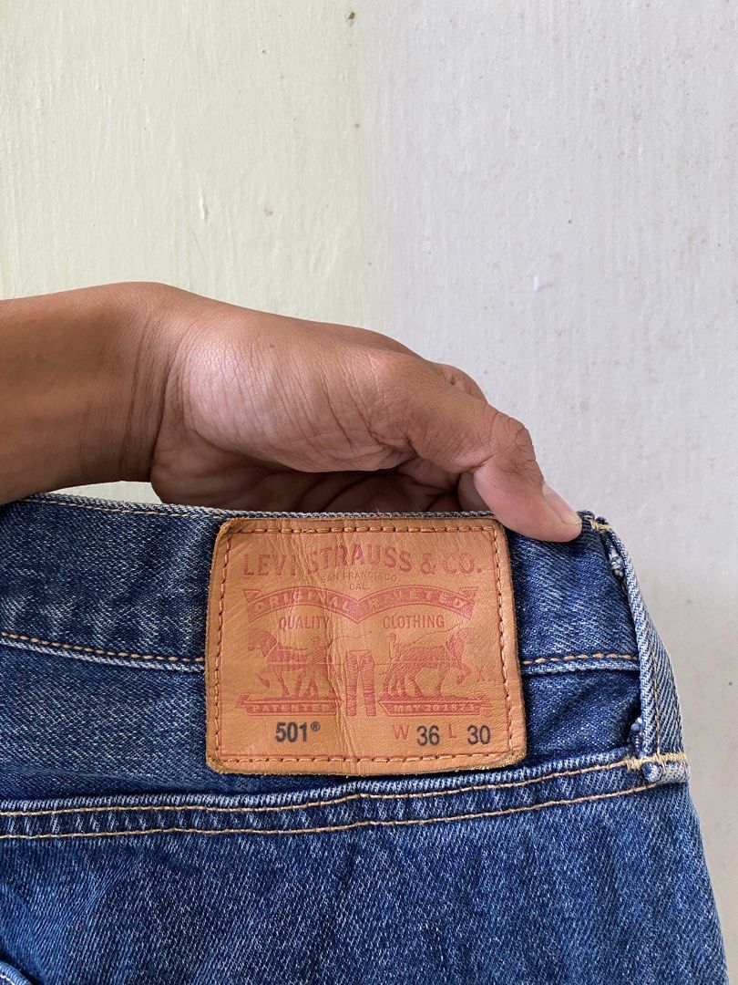 Levi's 501 Leather Patch (Category: Jeans) located in Pandi. Submitted by nasya_thrift_collection2023 (Listing ID 1470575504, Image 3). Description: - Brand: Levi's 501 - Color: Dark blue wash with natural fading - Size: W36 L30 - Fit: Straight leg cut - Details: Button fly, signature leather patch, and iconic red tab - Condition: Sturdy, quality denim fabric.