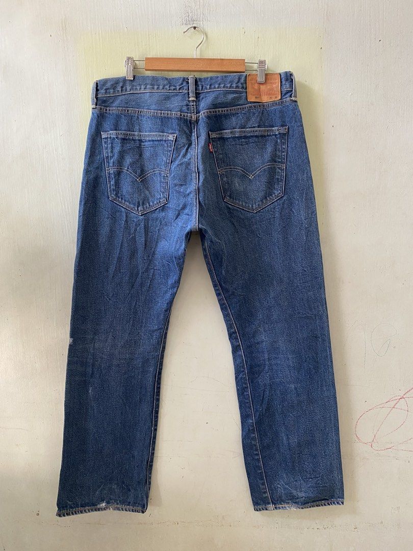 Levi's 501 Leather Patch (Category: Jeans) located in Pandi. Submitted by nasya_thrift_collection2023 (Listing ID 1470575504, Image 1). Description: - Brand: Levi's 501 - Color: Dark blue wash with natural fading - Size: W36 L30 - Fit: Straight leg cut - Details: Button fly, signature leather patch, and iconic red tab - Condition: Sturdy, quality denim fabric.