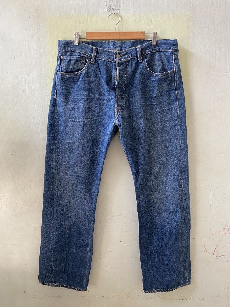 Levi's 501 Leather Patch (Category: Jeans) located in Pandi. Submitted by nasya_thrift_collection2023 (Listing ID 1470575504, Image 2). Description: - Brand: Levi's 501 - Color: Dark blue wash with natural fading - Size: W36 L30 - Fit: Straight leg cut - Details: Button fly, signature leather patch, and iconic red tab - Condition: Sturdy, quality denim fabric.