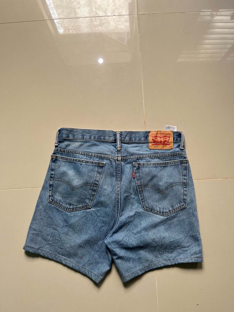 Levi's 516 Denim Shorts Size 34 (Category: Shorts) located in Lapu Lapu. Submitted by trip-thrift (Listing ID 1470642500, Image 1). Description: - Brand: Levi's (Model 516) - Size: 34 x 30 - Color: Light wash / mid-blue with natural fading - Details: Classic 5-pocket styling, iconic red tab on back pocket, and leather waist patch - Style: Trendy raw hem cutoff - Condition: Good pre-loved condition, ready to wear.