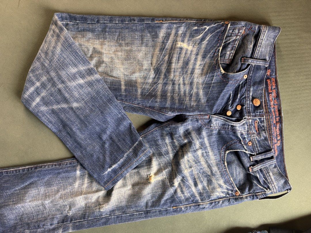Levi's Distressed Denim Jeans Button Fly Size 32 (Category: Jeans) located in Santa Lucia. Submitted by bryantevesartstudio (Listing ID 1470594095, Image 1). Description: Levi's distressed denim jeans. Button fly closure, copper-tone hardware. Vintage-inspired interior waistband text print. Heavy whiskering and fading wash throughout. Intentional distressing near pockets and hems. Brown leather patch on the back waistband. Classic arcuate stitchi