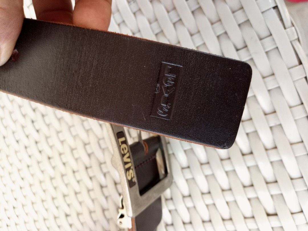 Levi's Genuine Leather Brown Belt (Category: Belts) located in Liloan. Submitted by dnznoon31 (Listing ID 1470600839, Image 2). Description: - Brand: Levi's - Color: Dark Brown - Size: 30 - 34 - Material: Genuine Leather - Hardware: Sturdy metal buckle with debossed logo - Details: Clean strap with contrast stitching and genuine leather stamp on the back - Condition: like new.