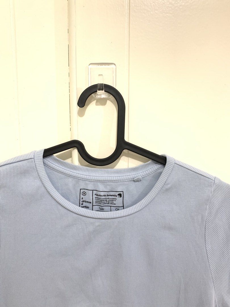 Light blue ribbed crop t-shirt size CH (Category: Shirts) located in Pasig City. Submitted by lovedbyri (Listing ID 1470688321, Image 3). Description: - Color: Light blue - Material: Sustainable soft stretchy cotton - Size: CH - Design: Ribbed texture, short sleeves, round neckline - Detail: Trendy lettuce trim hem - Styling: Great casual basic, easy to pair with jeans or shorts.