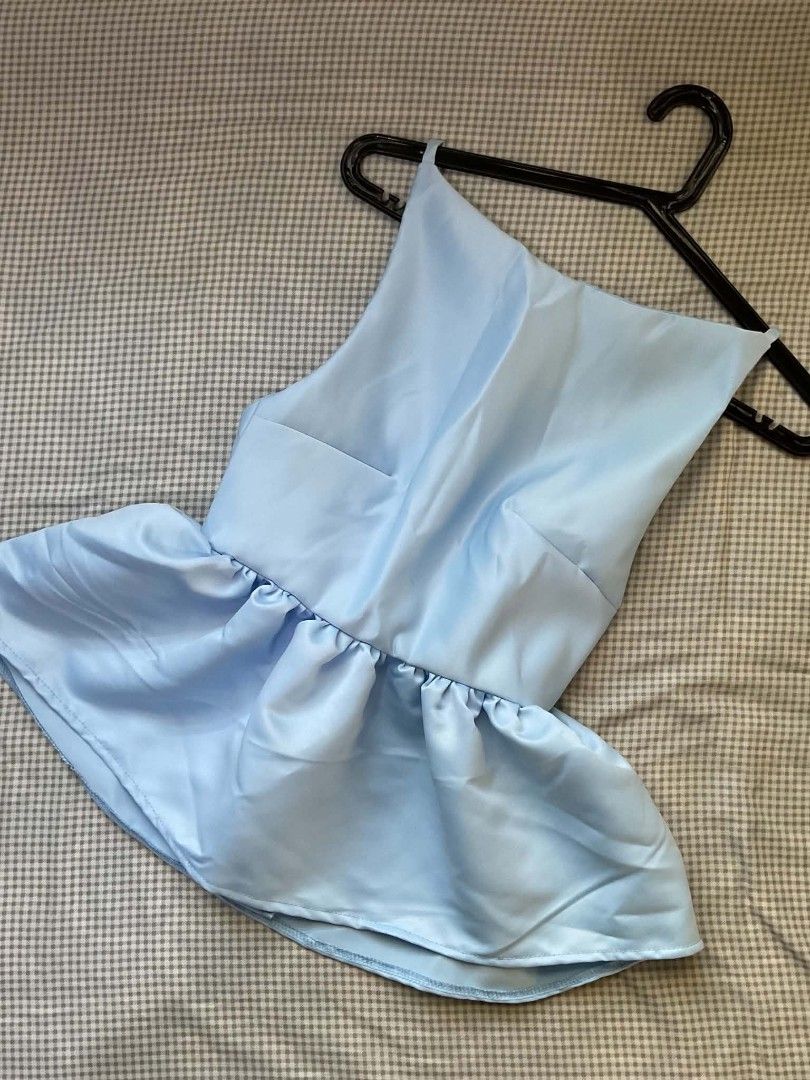 Light Blue Satin Peplum Backless Top (Category: Sleeveless) located in Marikina City. Submitted by minkookie__ (Listing ID 1470630847, Image 1). Description: BLUE PEPLUM TOP Price: 200 php + SF In great condition (New) RFS: Decluttering (Never used. Comes with a bag.) Can send more videos/pictures ! MOP/MOD: Gcash/SDD Location: Marikina City.
