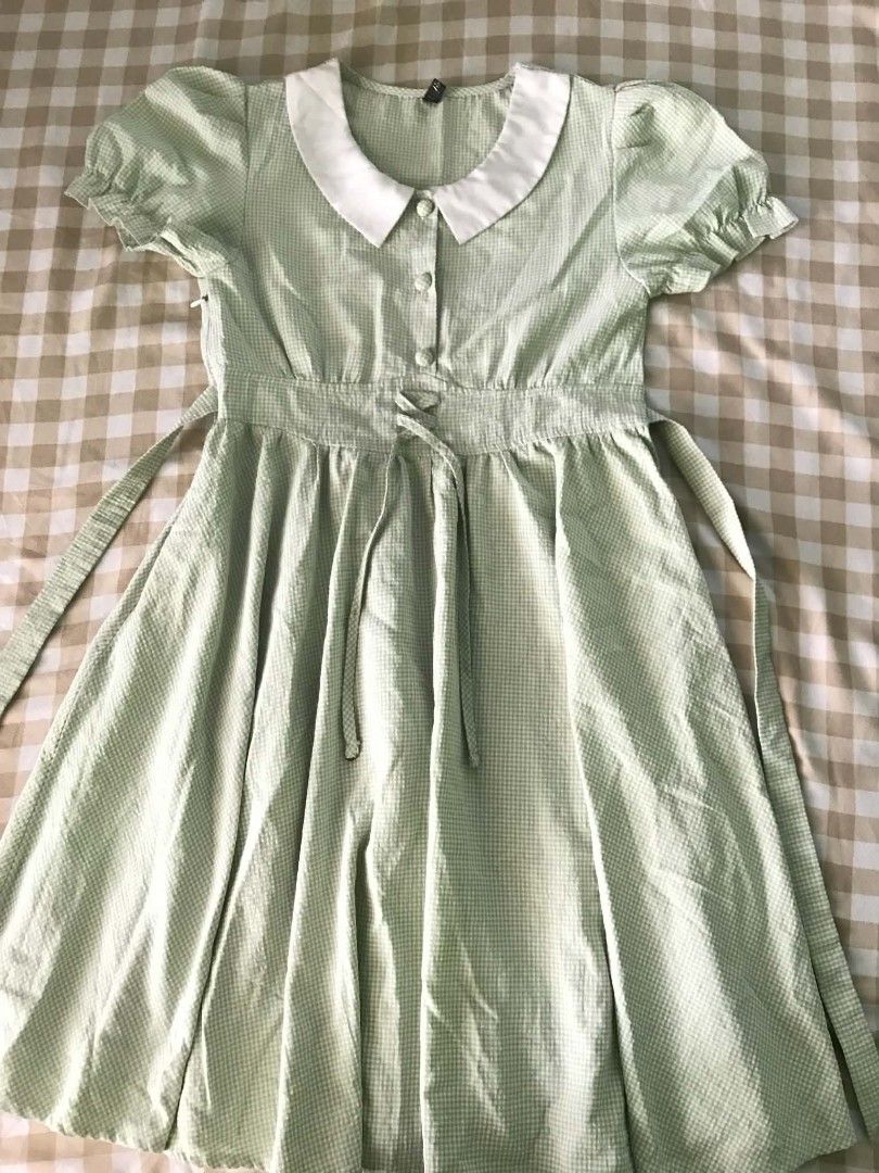 Light Green Gingham Dress With White Collar (Category: Dresses) located in Quezon City. Submitted by mysticowl.972175 (Listing ID 1470612455, Image 1). Description: - Details: White Peter Pan collar, decorative front buttons, and faux lace-up waist with back ties - Size: XS- S - Perfect for: Casual days, picnics, and cafe hopping!.