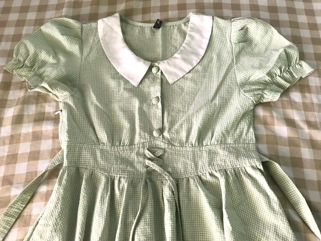 Light Green Gingham Dress With White Collar (Category: Dresses) located in Quezon City. Submitted by mysticowl.972175 (Listing ID 1470612455, Image 2). Description: - Details: White Peter Pan collar, decorative front buttons, and faux lace-up waist with back ties - Size: XS- S - Perfect for: Casual days, picnics, and cafe hopping!.