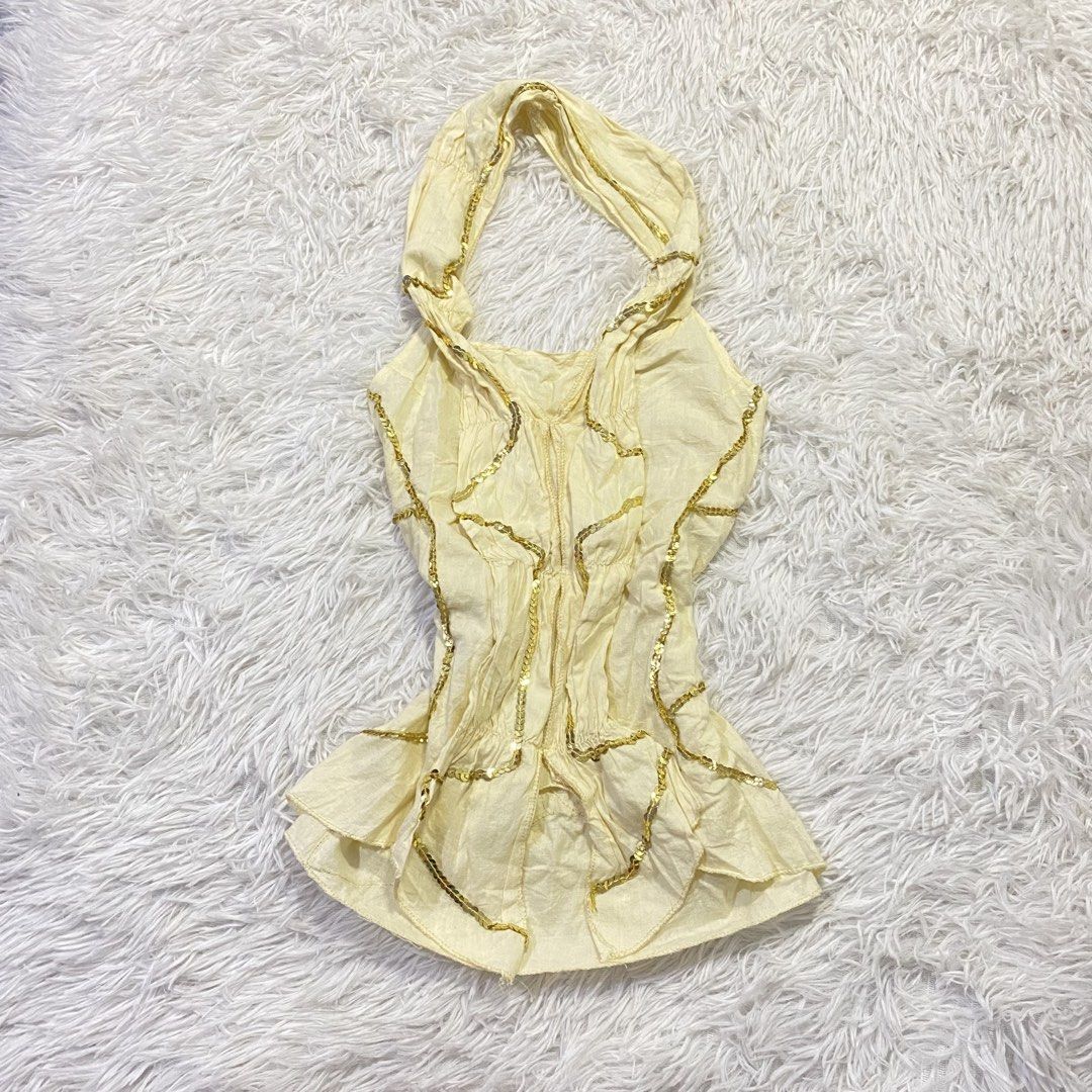 Light yellow halter neck top (Category: Sleeveless) located in Manila. Submitted by ukaysaukoy (Listing ID 1470641548, Image 1). Description: BRAND:Ones collection SIZE:XS-M .