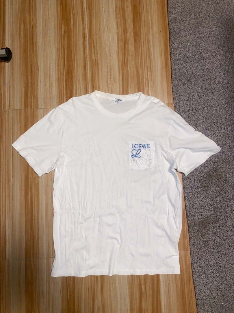 Loewe anagram pocket tee (Category: Tshirts & Polo Shirts ) located in Ilog. Submitted by mikesthrift_ (Listing ID 1470680025, Image 2). Description: Loewe Anagram Pocket Tee Width : 22 / Length : 29 Issue : see pic Price : 299+SF Dm if interested ☺️.