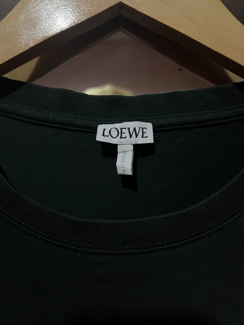 Loewe Dark Green Cotton Shirt (Category: Tshirts & Polo Shirts ) located in Sibulan. Submitted by rustysbestpick (Listing ID 1470663456, Image 2). Description: Loewe Dark Green Cotton Shirt Authentic/legit Excellent condition Washed & ready to wear Size medium on tag Made in Portugal Dimes: 19.5x28 759 Shipped Loc: Sibulan, Negros Oriental Visayas 6201 .