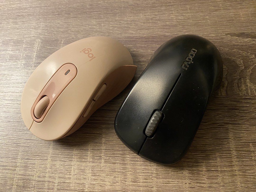 Logi and Rapoo Wireless Mice (Category: Mouse & Mousepads) located in Taguig. Submitted by miss_beloved.25 (Listing ID 1470580769, Image 2). Description: - Set of 2 wireless mice available together or separately - Pinkish beige Logitech mouse: Includes side buttons and scroll wheel - Black Rapoo mouse: Standard two-button layout with center wheel - Condition: Fully working with standard daily use wear - Perfect as reliable backup sets for laptop 