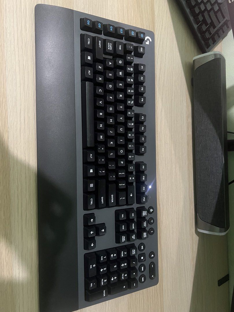 Logitech G613 Wireless Mechanical Gaming Keyboard (Category: Computer Keyboard) located in Taguig. Submitted by icarus007 (Listing ID 1470608423, Image 1). Description: - Brand: Logitech wireless mechanical gaming keyboard - Color: Dark gray - Layout: Full size with numeric keypad and dedicated left-side G-keys - Comfort: Integrated palm rest for long gaming sessions - Connectivity: Wireless via USB receiver or Bluetooth - Condition: Fully functi