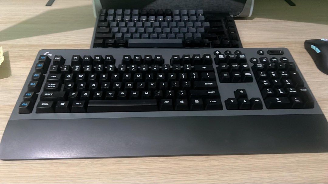 Logitech G613 Wireless Mechanical Gaming Keyboard (Category: Computer Keyboard) located in Taguig. Submitted by icarus007 (Listing ID 1470608423, Image 2). Description: - Brand: Logitech wireless mechanical gaming keyboard - Color: Dark gray - Layout: Full size with numeric keypad and dedicated left-side G-keys - Comfort: Integrated palm rest for long gaming sessions - Connectivity: Wireless via USB receiver or Bluetooth - Condition: Fully functi