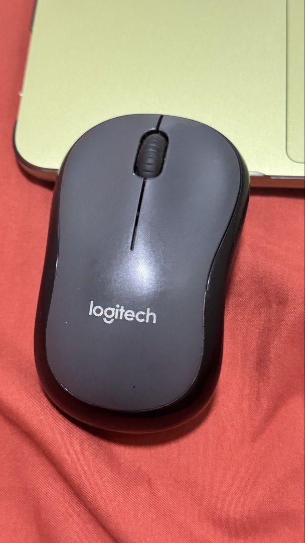 Logitech M220 Silent Wireless Mouse (Category: Mouse & Mousepads) located in Marikina City. Submitted by sdpii (Listing ID 1470693982, Image 1). Description: - Model: Logitech M220 Wireless Mouse - Color: Dark Grey - Condition: Works great, minor signs of previous usage on the casing - Design: Compact shape, comfortable for daily use - Portability: USB receiver conveniently stored inside the battery compartment - Power: Requires 1 AA battery - RF
