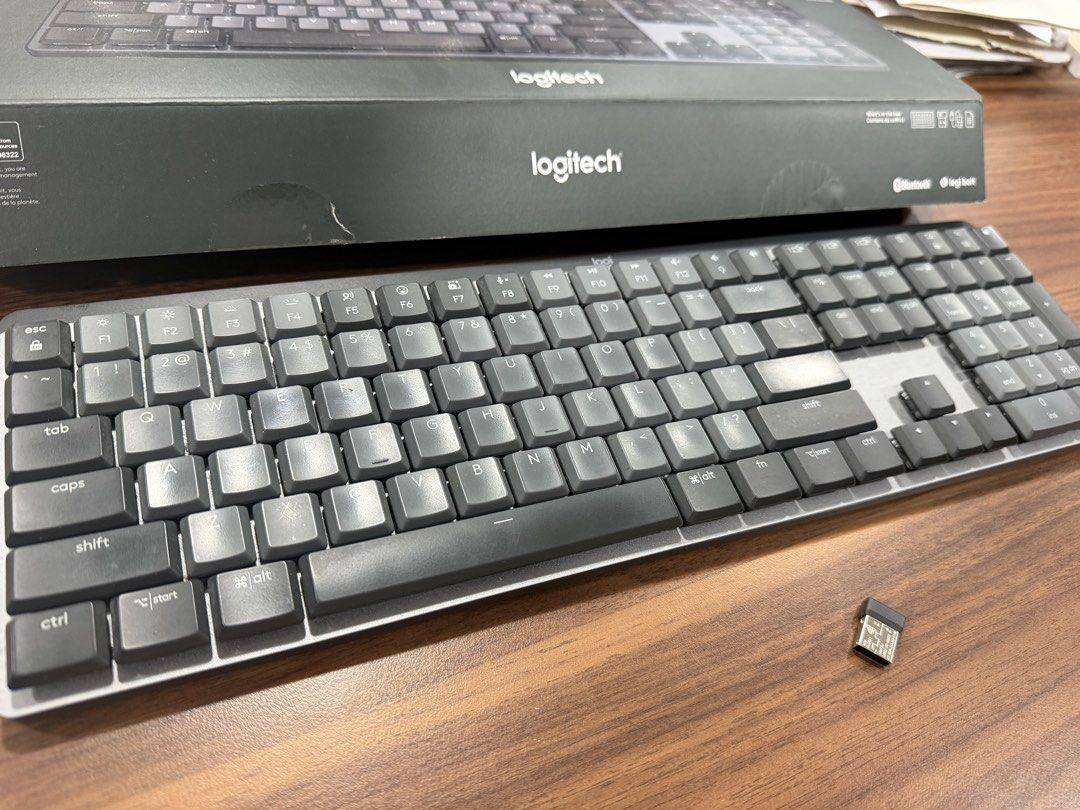 Logitech MX Mechanical Wireless Illuminated Keyboard (Category: Computer Keyboard) located in Manila. Submitted by luxurysellermanila (Listing ID 1470740994, Image 2). Description: - Model: Logitech MX Mechanical Wireless Keyboard (Graphite) - Layout: Full size with Tactile Quiet switches - Connectivity: Bluetooth or Logi Bolt USB receiver (Multi-device pairing supported) - Inclusions: Original box and Logi Bolt receiver - Condition: Clean, minim