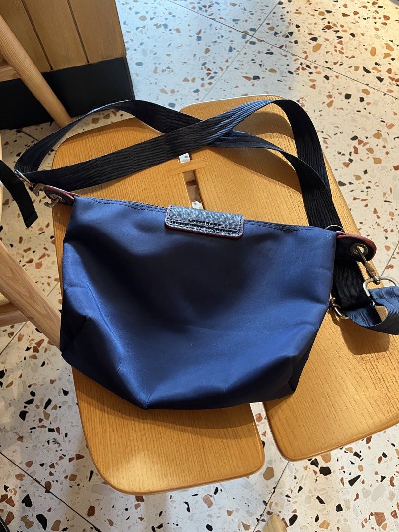 LONGCHAMP Mini Le Pliage (Without handle) (Category: Cross-body Bags) located in Quezon City. Submitted by ynfvilla (Listing ID 1470626031, Image 2). Description: Authentic Longchamp Le Pliage in navy blue — Lightweight; water-resistant material — Spacious interior with zip closure — Great everyday or travel bag Honest Issue: Gently used but lock of strap snapped off / O-ring fell out RFS: decluttering Loc: Katipunan, QC — NEGOTIABLE ‼️ dm me you