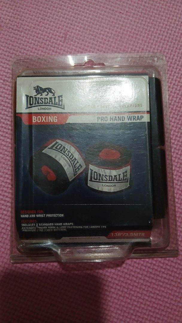 Lonsdale Pro Hand Wrap 3.5M Traditional Herringbone (Category: Combat Sports) located in Manila. Submitted by oddfire.10fe9b (Listing ID 1470575463, Image 2). Description: - Brand: Lonsdale Pro - Color: Black and Red - Condition: Brand new, unopened in original packaging - Length: Standard 3.5 meters / 138 inches - Material: Traditional herringbone style for durability and comfort - Closure: Secure hook and loop fastening system.