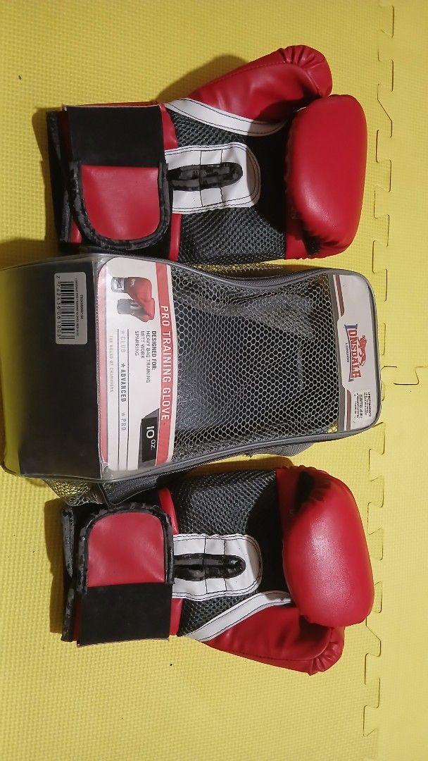 Lonsdale Pro Training Boxing Gloves 10oz Red (Category: Combat Sports) located in Manila. Submitted by oddfire.10fe9b (Listing ID 1470574441, Image 2). Description: - Brand: Lonsdale - Color: Red - Size: 10 oz - Condition: Brand new, never used, stored in original packaging - Ideal for: Heavy bag training, mitt work, and sparring - Inclusions: Original mesh carrying bag with zip closure RFS: Decluttering. Negotiable.