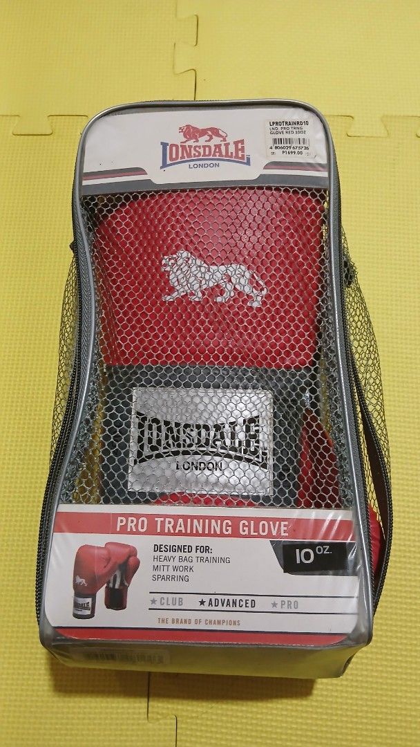 Lonsdale Pro Training Boxing Gloves 10oz Red (Category: Combat Sports) located in Manila. Submitted by oddfire.10fe9b (Listing ID 1470574441, Image 3). Description: - Brand: Lonsdale - Color: Red - Size: 10 oz - Condition: Brand new, never used, stored in original packaging - Ideal for: Heavy bag training, mitt work, and sparring - Inclusions: Original mesh carrying bag with zip closure RFS: Decluttering. Negotiable.