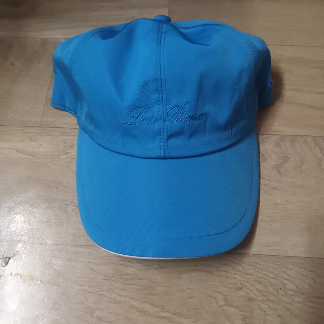 Loro Piana SS Cap Azure Blue (Category: Caps & Hats) located in Manila. Submitted by itsnik444 (Listing ID 1470601746, Image 1). Description: - Authentic Loro Piana cap made in Italy - Color: Bright blue - Storm System technology for waterproof and wind-resistant weather protection - Embroidered Loro Piana script logo on the side panel - Small metal brand plaque near the back - Classic plaid interior lining with a brown sweatband - Elastic back c