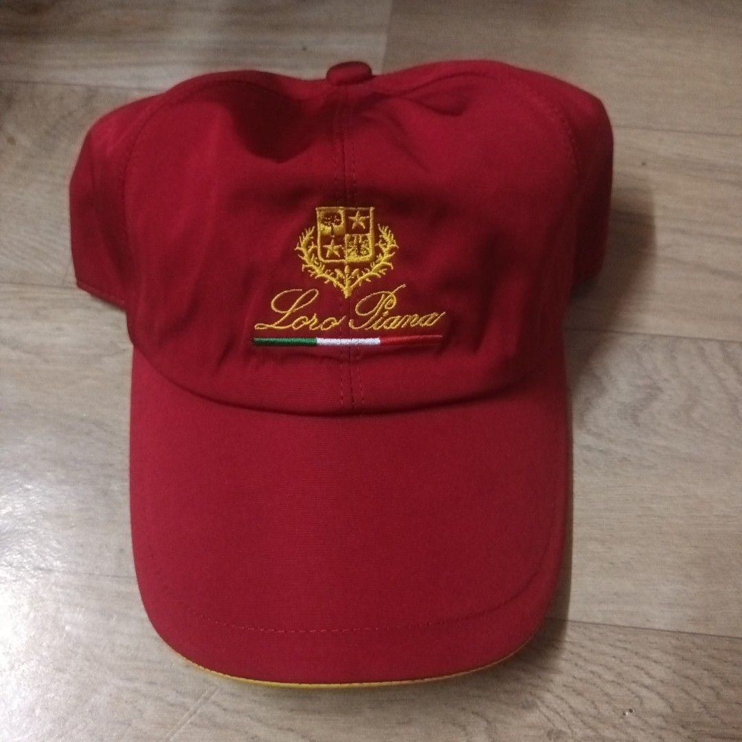 Loro Piana SS Cap Crimson Red (Category: Caps & Hats) located in Manila. Submitted by itsnik444 (Listing ID 1470602463, Image 1). Description: - Authentic Loro Piana red cap made in Italy - Equipped with signature Storm System weather-resistant technology - Features front embroidered crest with Italian flag detail - Stylish plaid fabric interior lining - Elastic back strap for a comfortable, adjustable fit - Condition: Excellent / Pristine - DM f