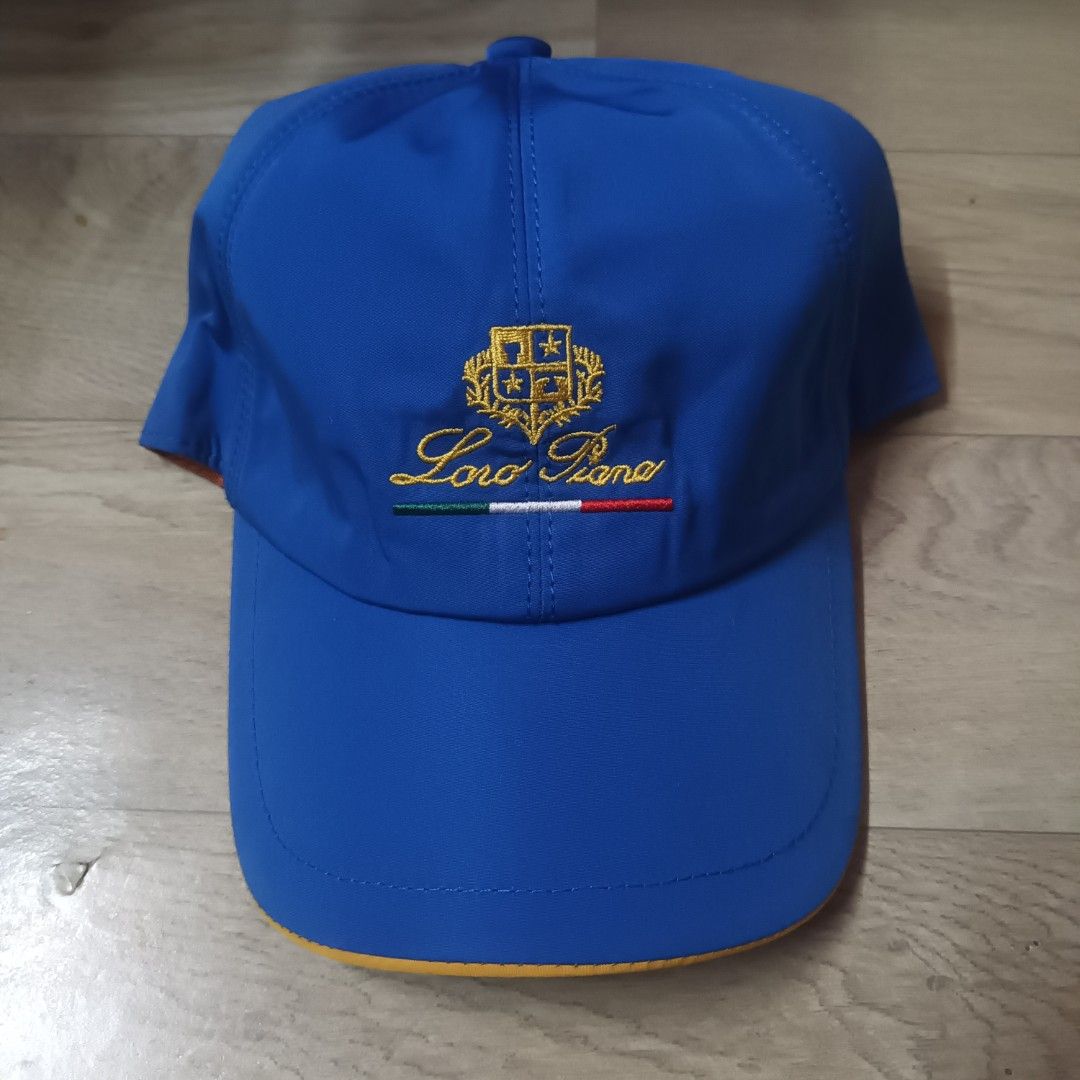 Loro Piana SS Cap Royal Blue (Category: Caps & Hats) located in Manila. Submitted by itsnik444 (Listing ID 1470602070, Image 1). Description: - Brand: Loro Piana - Color: Bright blue with green, white, and red embroidery - Material/Tech: Storm System fabric (Made in Italy) - Design details: Classic plaid inner lining, yellow brim underside, and brown sweatband - Fit: Elastic band at the back for a flexible fit - Condition: Excellent, 100% authent