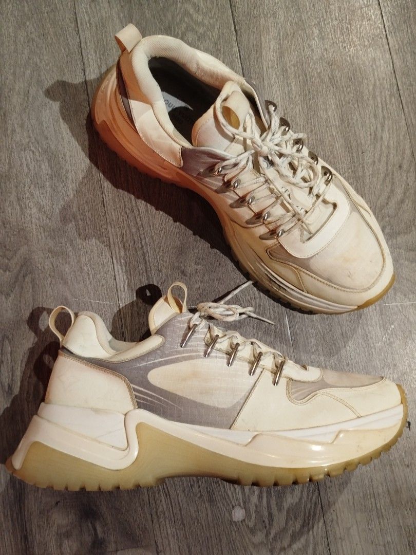 Louis Vuitton LV Sunset Trail Sneaker White (Category: Sneakers & Footwear) located in Quezon City. Submitted by epoquebyjaz (Listing ID 1470631438, Image 2). Description: - Authentic Louis Vuitton chunky sneakers in white and grey - Bold thick rubber soles with heavy lug tread pattern - Iconic LV logo on the tongue with silver-tone hardware - Convenient pull tabs at the heel and tongue - Stylish lace-up closure with original patterned laces - Co