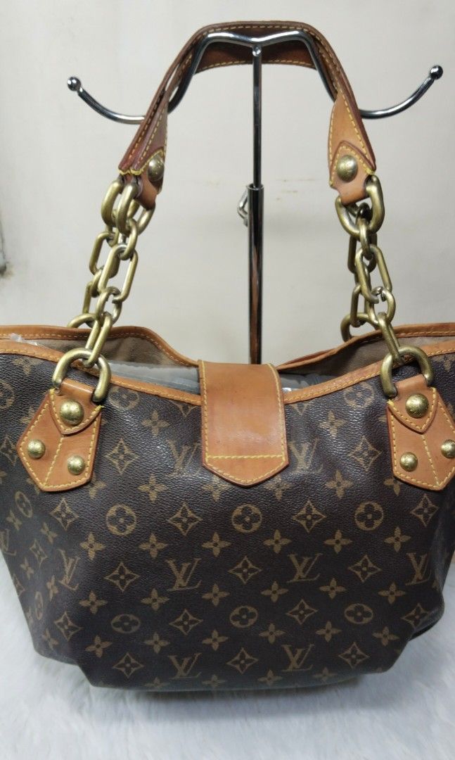Louis Vuitton Monogram Canvas Tote Bag with Bow and Chain Strap (Category: Luxury Bags & Wallets) located in Manila. Submitted by mudrascloset.ph (Listing ID 1470647398, Image 2). Description: - Classic Monogram canvas tote bag with elegant brown leather trim - Secure front flap closure featuring a cute leather bow and metallic lock accent - Comfortable double chain and leather shoulder straps - Spacious lined interior with four protective feet o