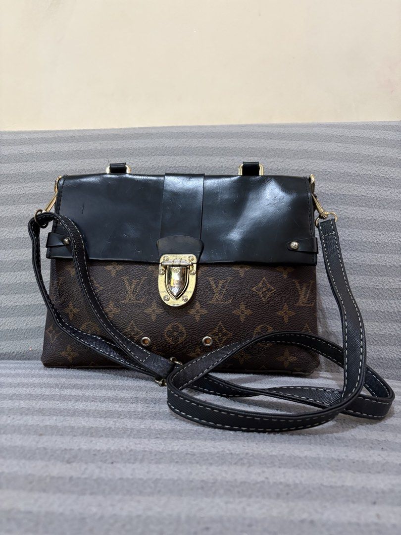 Louis Vuitton Monogram Canvas Shoulder Bag (Category: Luxury Bags & Wallets) located in Pasig City. Submitted by mau_llamas (Listing ID 1470691596, Image 1). Description: - Brand: Louis Vuitton - Design: Classic monogram canvas combined with a chic black leather flap top - Hardware: Elegant gold-tone push-lock closure and matching hardware - Strap: Adjustable black textured strap with stylish contrast stitching - Condition: Excellent pre-loved co