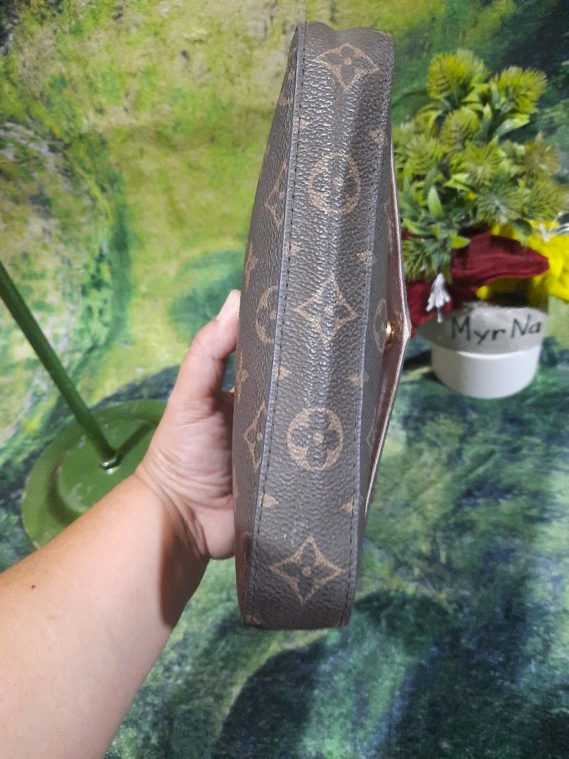 Louis Vuitton Monogram Chain Crossbody Bag (Category: Luxury Bags & Wallets) located in Baguio. Submitted by klayblakeb87803 (Listing ID 1470628294, Image 3). Description: - Style: Crossbody bag with envelope flap and snap button closure - Material: Classic brown monogram canvas with gold-tone chain strap - Interior: Pink fabric lining with a convenient slip pocket and Louis Vuitton Paris tag - Dimensions: 8 inches (base) x 5 inches (height) - Co
