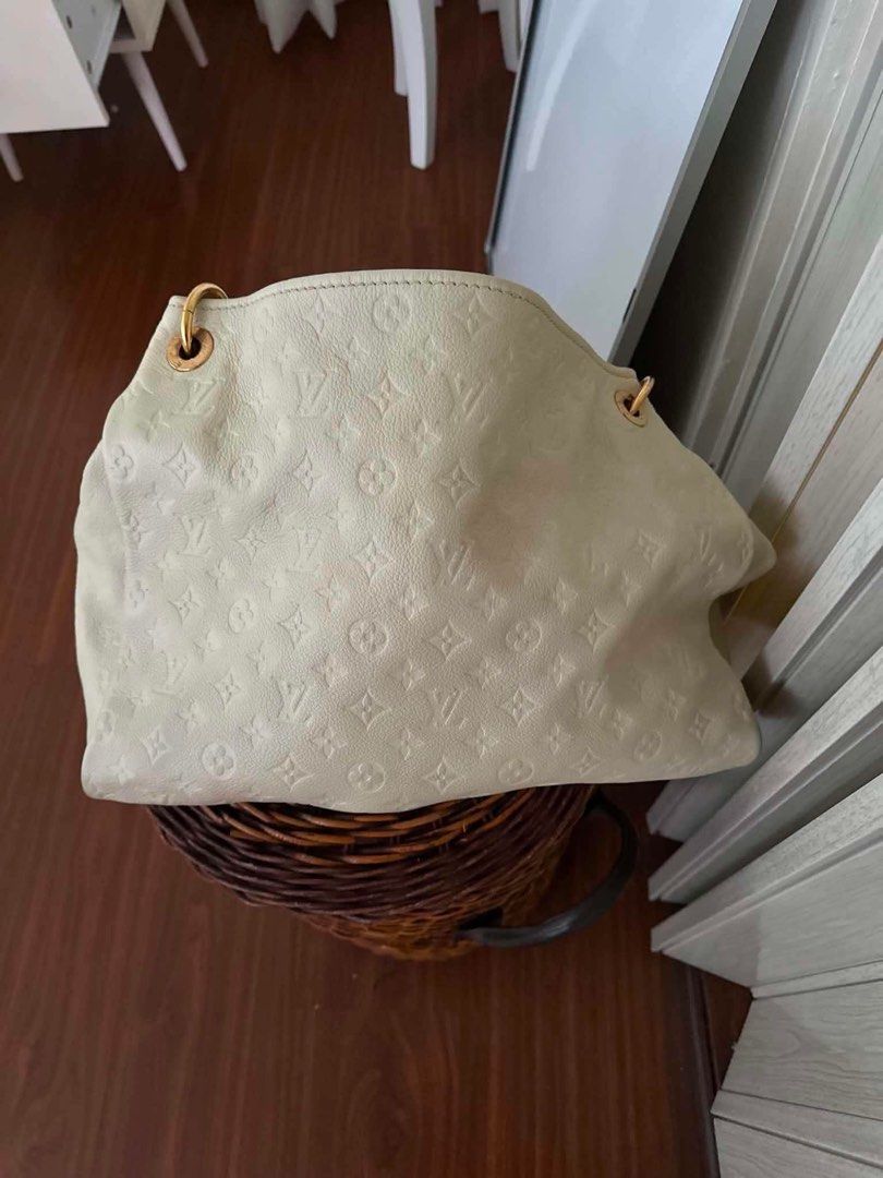 Louis Vuitton Monogram Empreinte Leather Hobo Bag White (Category: Luxury Bags & Wallets) located in Dagupan City. Submitted by makilux.ph (Listing ID 1470602958, Image 2). Description: - Brand: Louis Vuitton - Style: Hobo Bag / Top Handle - Material: Cream leather with embossed monogram pattern - Hardware: Gold-tone - Interior: Blue and white striped fabric lining with zip pocket - Authenticity details: Made in France leather tag, Date code AS01