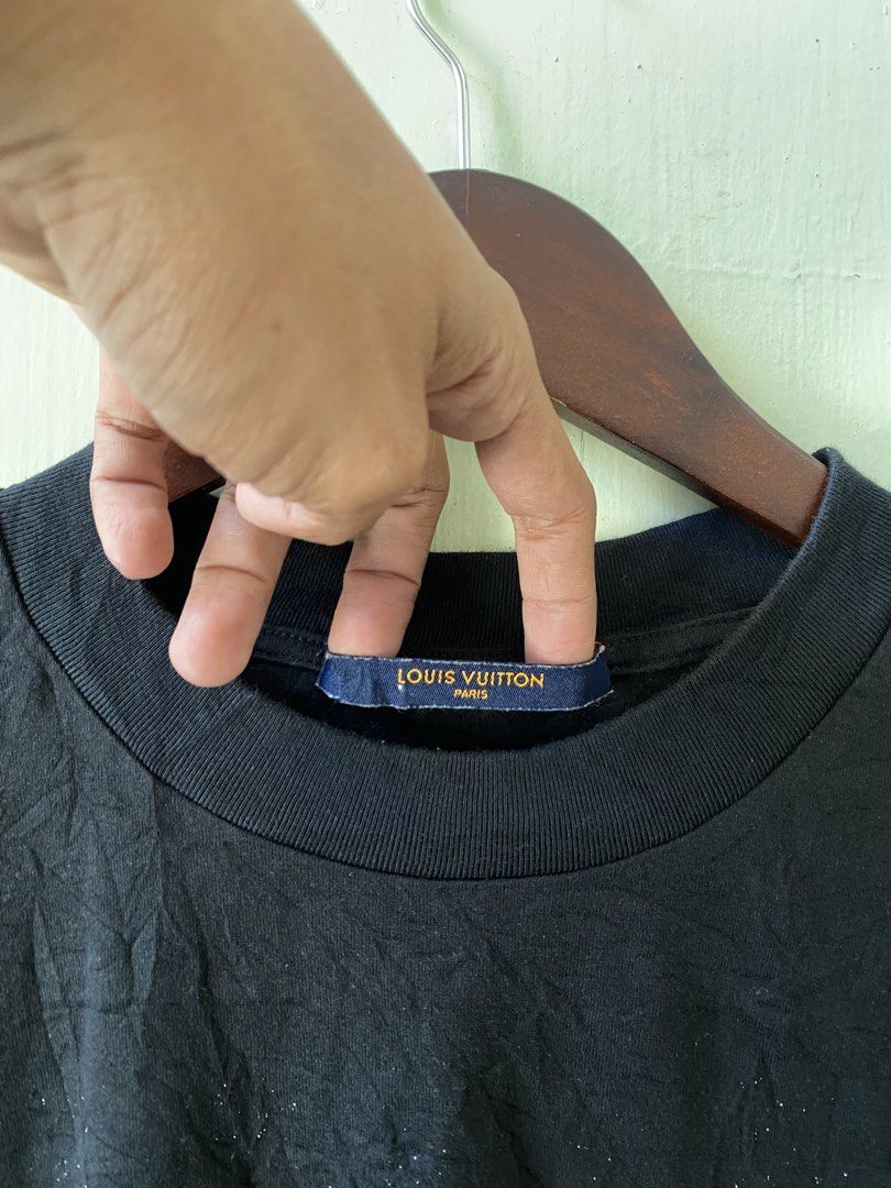 Louis Vuitton Monogram Gradient Black T-Shirt (Category: Tshirts & Polo Shirts ) located in Pandi. Submitted by nasya_thrift_collection2023 (Listing ID 1470575488, Image 2). Description: - Brand: Louis Vuitton - Item: Cotton Tee - Color/Pattern: Black with white gradient monogram fading at the bottom - Size: M - Origin: Made in Italy - Details: Classic crew neck, short sleeves, interior care tags intact.