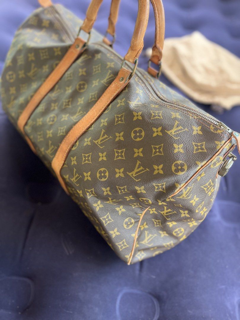 Louis Vuitton Monogram Keepall 50 Boston (Category: Luxury Bags & Wallets) located in Tacloban City. Submitted by luxbag_phhh (Listing ID 1470577988, Image 2). Description: Authentic Louis Vuitton Monogram Keepall 50 travel bag. Classic monogram canvas with vintage patina leather handles. Spacious interior for weekend trips. Includes original dust bag. No open pipe Clean interior/exterior No cracks on coated canvas With og dust bag Guaranteed aut