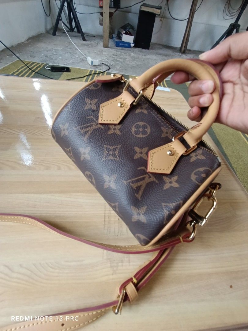 Louis Vuitton Monogram Nano Speedy Bag (Category: Luxury Bags & Wallets) located in Naguilian. Submitted by jhoyukay (Listing ID 1470689173, Image 2). Description: - Authentic Louis Vuitton monogram canvas barrel bag - Includes top handle and adjustable strap for versatile wear - Elegant gold-tone hardware and brown interior lining - Secure top zipper closure - Stamped Louis Vuitton Paris Made in France interior leather tag.