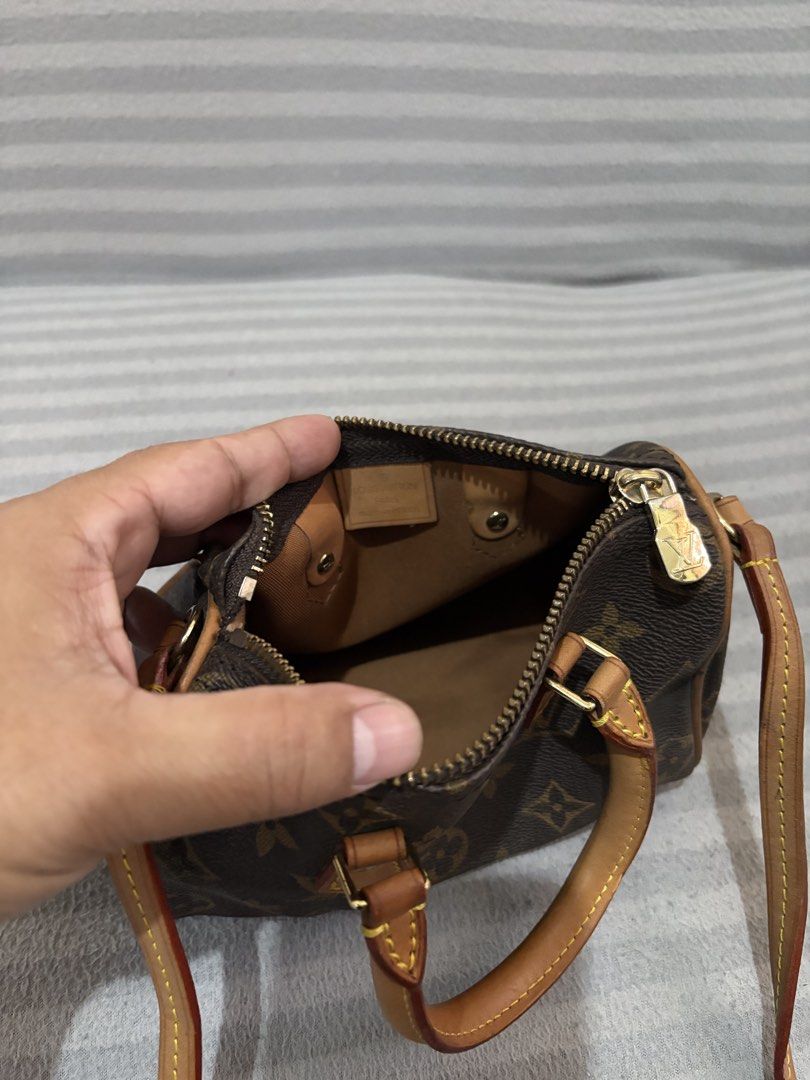 Louis Vuitton Monogram Nano Speedy Bag (Category: Luxury Bags & Wallets) located in Pasig City. Submitted by mau_llamas (Listing ID 1470689664, Image 2). Description: - Louis Vuitton Nano Speedy bag - Classic monogram coated canvas with natural vachetta leather trim - Shiny gold-tone hardware and dual rolled top handles - Ideal everyday mini bag that fits your daily essentials - Condition and inclusions as seen in photos - Authentication not gura