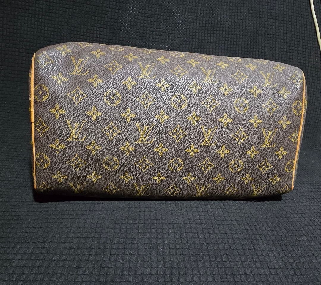 Louis Vuitton Monogram Speedy Handbag - Negotiable!!! (Category: Luxury Bags & Wallets) located in Manila. Submitted by axelyuna.27 (Listing ID 1470571440, Image 2). Description: Classic Louis Vuitton monogram canvas handbag. Brown with gold-tone hardware and vachetta leather trim. Dual rolled leather top handles. Top zip closure. Spacious interior for daily essentials. Iconic vintage travel bag style. Natural patina on leather handles and trim. 