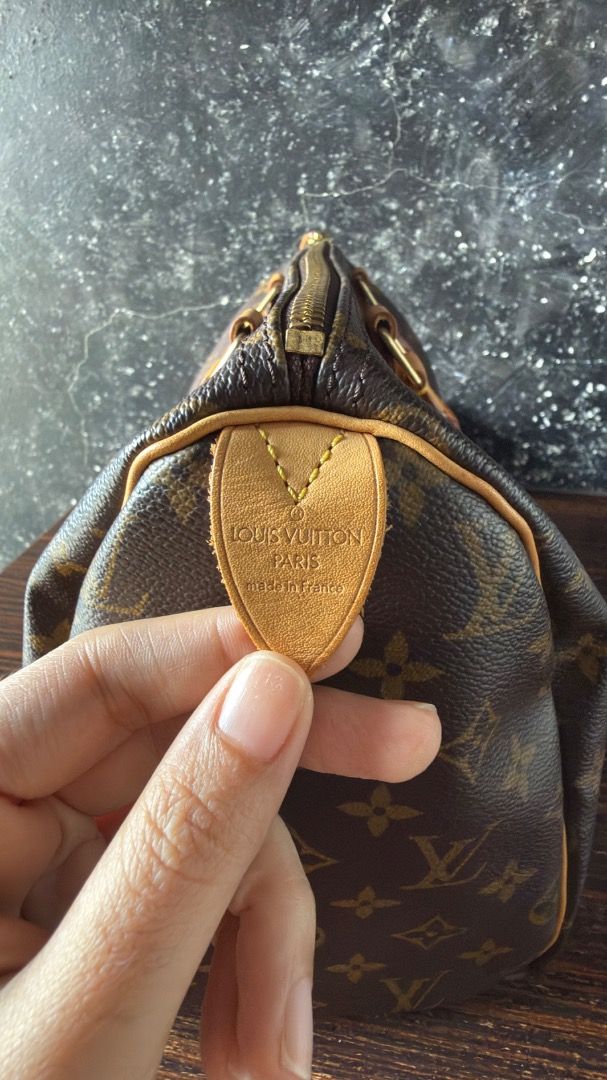 Louis Vuitton Monogram Speedy Handbag (Category: Luxury Bags & Wallets) located in Manila. Submitted by ac32370 (Listing ID 1470603499, Image 2). Description: - Authentic Louis Vuitton monogram canvas handbag - Double leather top handles with signature yellow stitching - Secure gold-tone brass zipper closure with engraved pull tab - Louis Vuitton Paris 'Made in France' heat stamp - Clean piped edges with a structured, elegant shape.