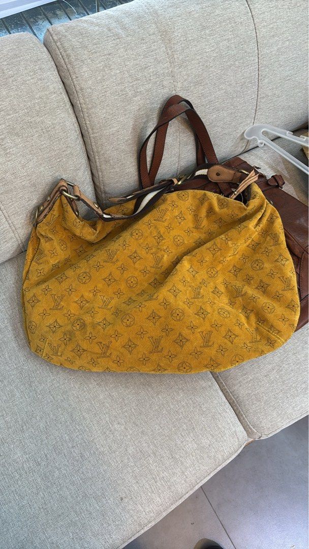 Louis Vuitton Monogram Suede Yellow Shoulder Bag (Category: Luxury Bags & Wallets) located in Caloocan City. Submitted by neweagle-424b (Listing ID 1470696254, Image 2). Description: missing serial code - Brand: Louis Vuitton - Material: Yellow suede with Monogram print and brown monogram fabric lining - Strap: Brown and white adjustable fabric strap with brass hardware - Closure: Top zip with LV branded pull tab (shows slight wear at the ends) -