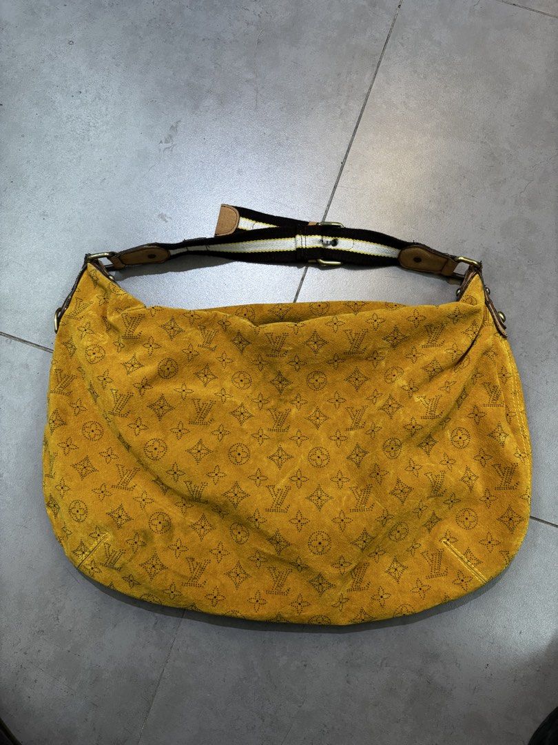 Louis Vuitton Monogram Suede Yellow Shoulder Bag (Category: Luxury Bags & Wallets) located in Caloocan City. Submitted by neweagle-424b (Listing ID 1470696254, Image 1). Description: missing serial code - Brand: Louis Vuitton - Material: Yellow suede with Monogram print and brown monogram fabric lining - Strap: Brown and white adjustable fabric strap with brass hardware - Closure: Top zip with LV branded pull tab (shows slight wear at the ends) -