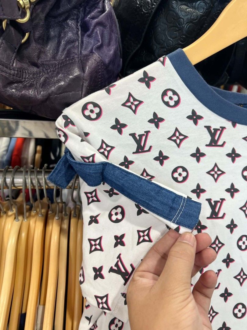 Louis Vuitton Monogram White Pink Tee Shirt (Category: Shirts) located in Urdaneta. Submitted by jayceegarage (Listing ID 1470690292, Image 3). Description: - Designer-style white t-shirt with iconic Louis Vuitton monogram print - Eye-catching pink and black details with a contrast blue rib knit crew neckline - Unique short sleeves finished with trendy denim fabric straps - Size: Large (tag inside collar) - Origin: Made in Italy - Care Instructio