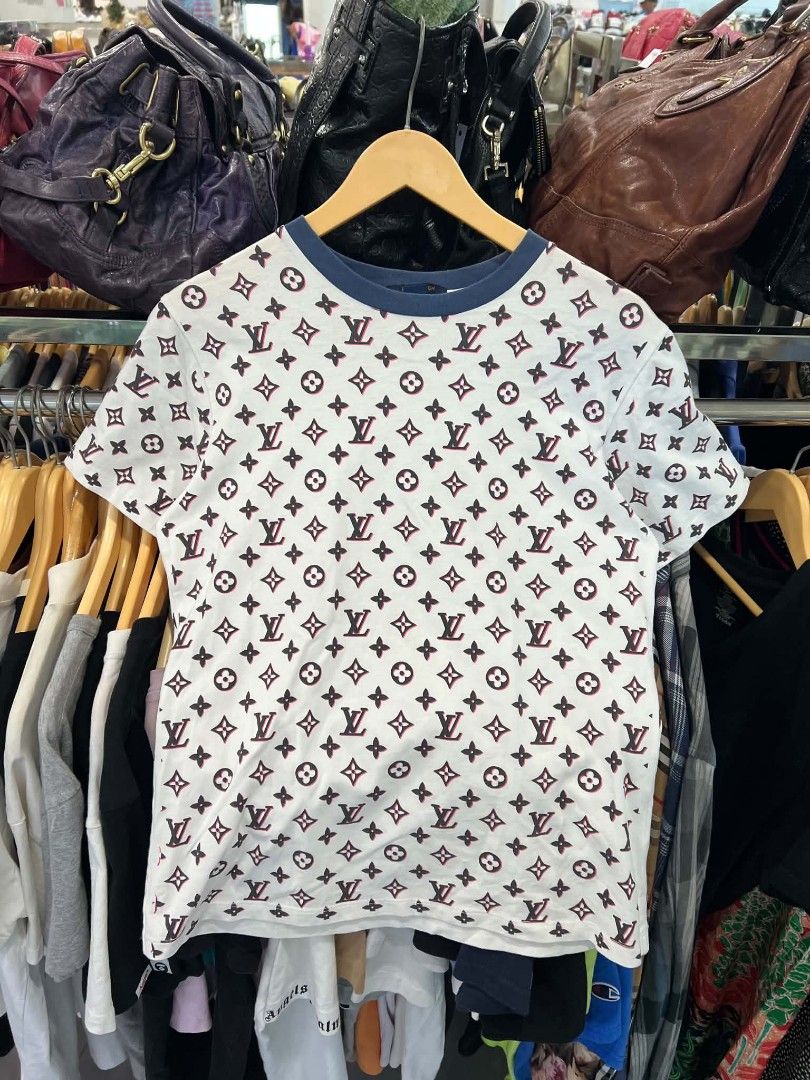 Louis Vuitton Monogram White Pink Tee Shirt (Category: Shirts) located in Urdaneta. Submitted by jayceegarage (Listing ID 1470690292, Image 1). Description: - Designer-style white t-shirt with iconic Louis Vuitton monogram print - Eye-catching pink and black details with a contrast blue rib knit crew neckline - Unique short sleeves finished with trendy denim fabric straps - Size: Large (tag inside collar) - Origin: Made in Italy - Care Instructio