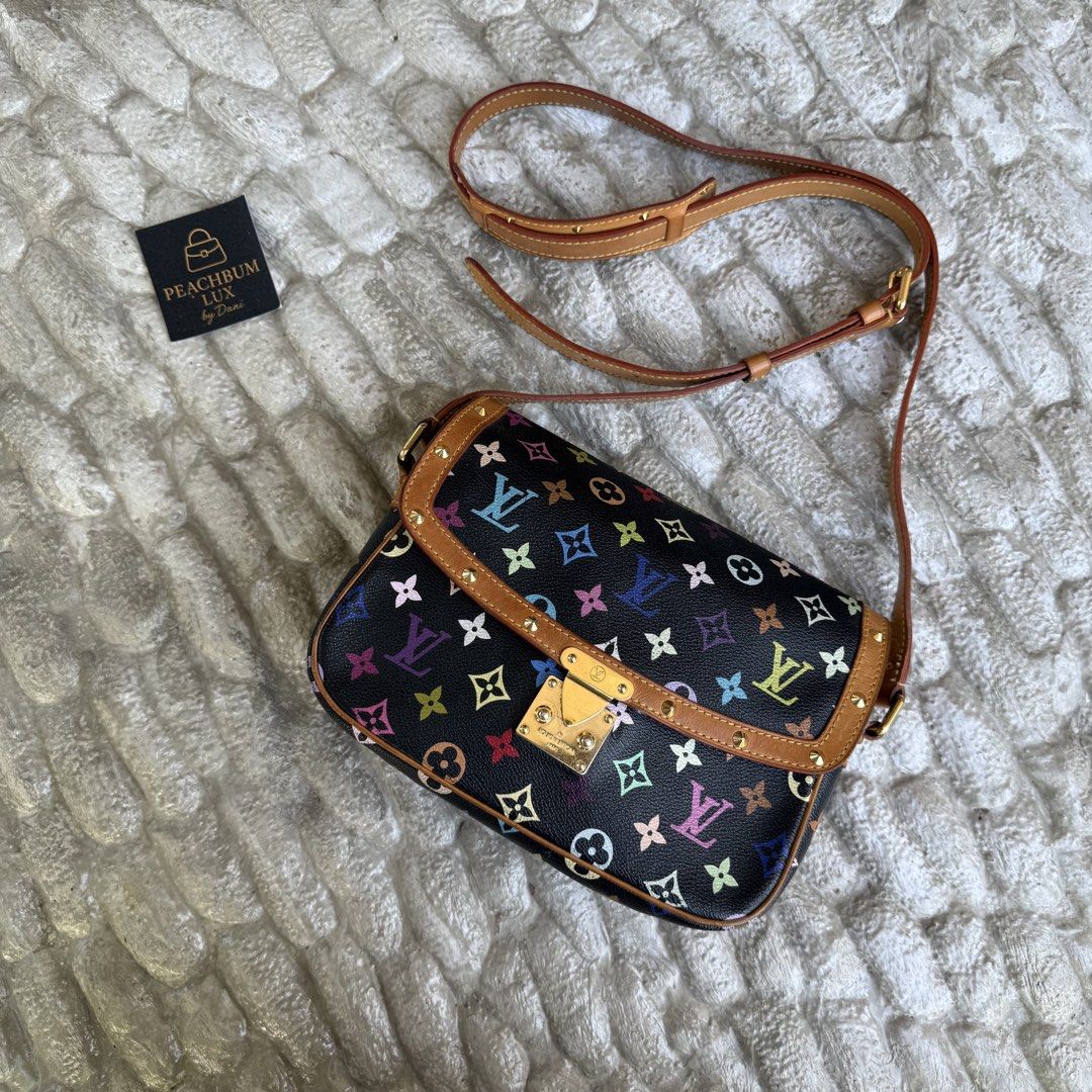 Louis Vuitton Multicolore Monogram Black Sologne Bag (Category: Luxury Bags & Wallets) located in Baguio. Submitted by peachbumapparel (Listing ID 1470721175, Image 1). Description: - Authentic Louis Vuitton x Takashi Murakami collaboration - Iconic black Monogram Multicolore canvas with tan leather trim - Secure push-lock closure and shiny gold-tone hardware - Adjustable leather crossbody strap with chic stud details - Well-maintained condition 
