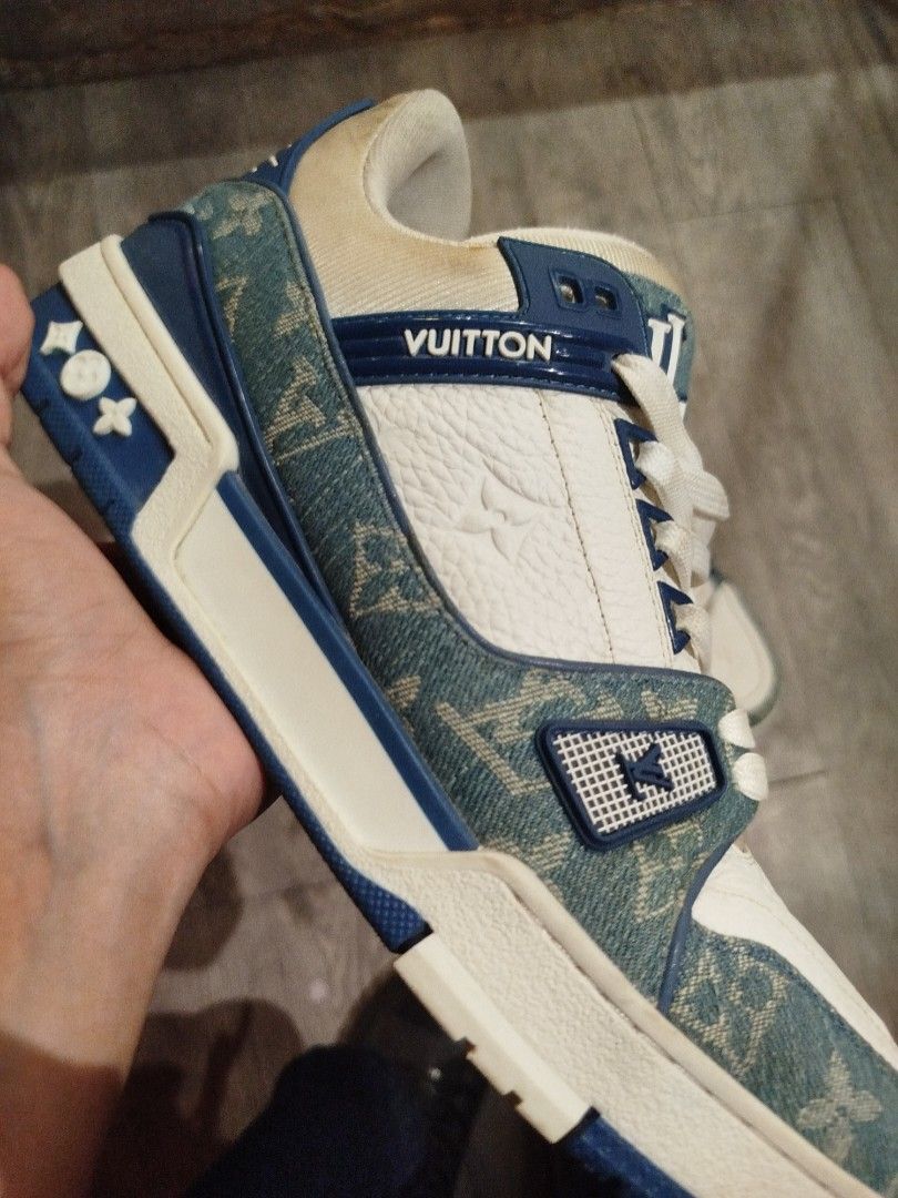 Louis Vuitton Trainer Denim Blue White Shoes (Category: Sneakers) located in Quezon City. Submitted by epoquebyjaz (Listing ID 1470623811, Image 3). Description: - Authentic Louis Vuitton Trainer sneakers designed by Virgil Abloh - Colorway: Blue monogram denim and crisp white leather - Signature details: LV initials on tongue and side, VUITTON rubber accent on side panel - Comfort features: Padded collar and thick branded rubber sole - Origin: M