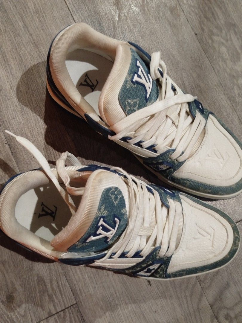 Louis Vuitton Trainer Denim Blue White Shoes (Category: Sneakers) located in Quezon City. Submitted by epoquebyjaz (Listing ID 1470623811, Image 2). Description: - Authentic Louis Vuitton Trainer sneakers designed by Virgil Abloh - Colorway: Blue monogram denim and crisp white leather - Signature details: LV initials on tongue and side, VUITTON rubber accent on side panel - Comfort features: Padded collar and thick branded rubber sole - Origin: M