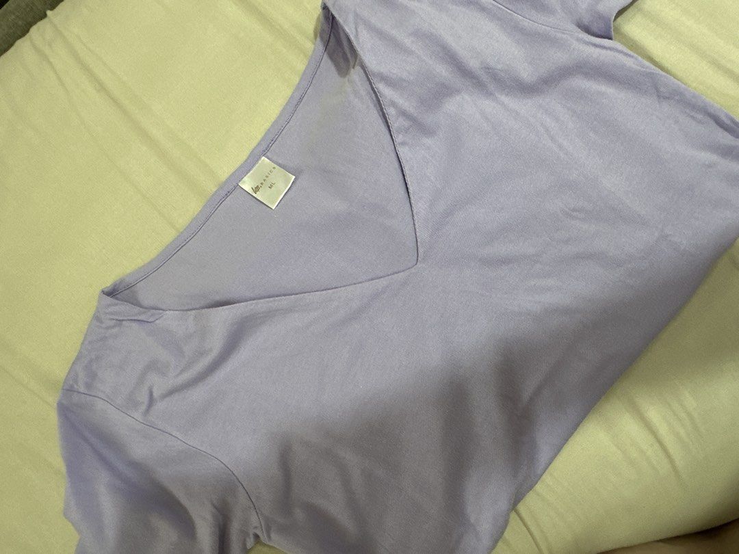 Basics V-Neck T-Shirt Lavender ML (Category: Shirts) located in Manila. Submitted by aj.honey (Listing ID 1470587237, Image 1). Description: - Brand: Love, Bonito Basics - Color: Lavender Purple - Size: ML - Style: V-neck, short sleeves, lightweight fabric - Condition: Great for daily casual wear, easy to pair with jeans or skirts.