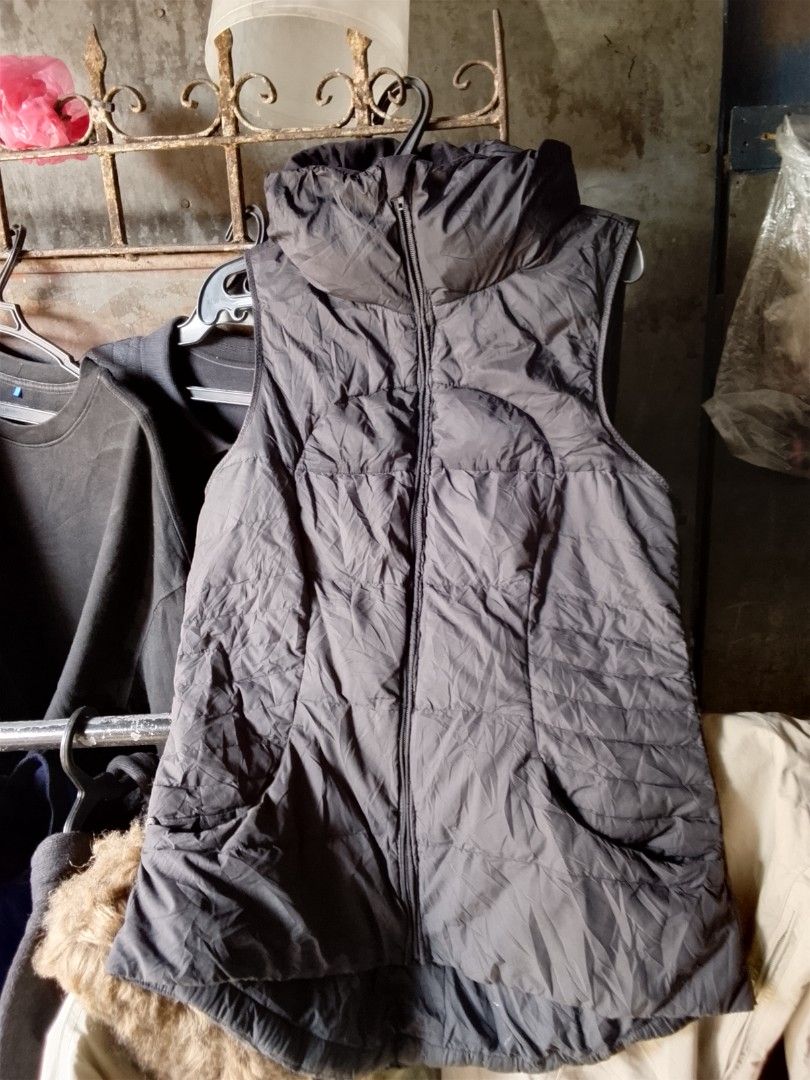 Lululemon Black Puffer Vest With High Collar (Category: Coats, Jackets and Outerwear) located in Manila. Submitted by warmcloud-06f3 (Listing ID 1470650927, Image 3). Description: - Brand: Lululemon - Color: Classic Black - Style: Sleeveless puffer vest with high collar and front zip - Details: Iconic circular logo on upper back, quilted pattern on lower back - Pockets: Functional front zippered pockets - Fit & Feel: Lightweight, versatile, and g