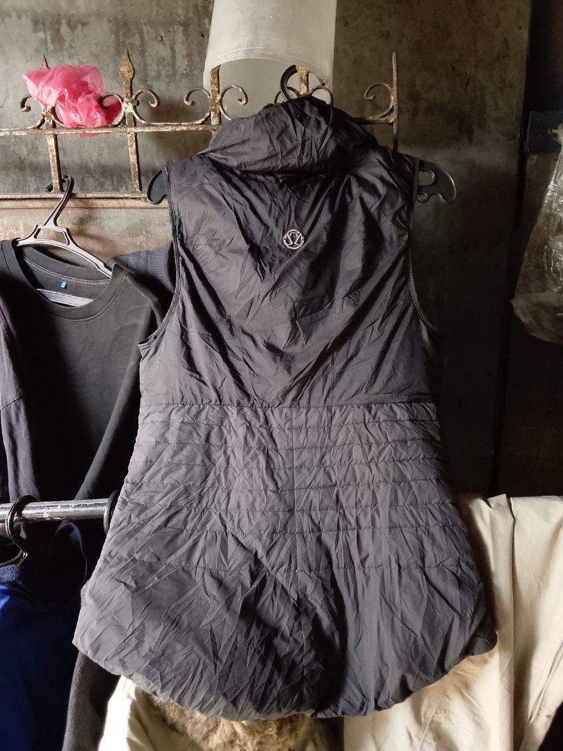 Lululemon Black Puffer Vest With High Collar (Category: Coats, Jackets and Outerwear) located in Manila. Submitted by warmcloud-06f3 (Listing ID 1470650927, Image 1). Description: - Brand: Lululemon - Color: Classic Black - Style: Sleeveless puffer vest with high collar and front zip - Details: Iconic circular logo on upper back, quilted pattern on lower back - Pockets: Functional front zippered pockets - Fit & Feel: Lightweight, versatile, and g